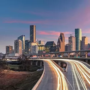 Houston, Texas, USA downtown skyline over the highways at dusk
