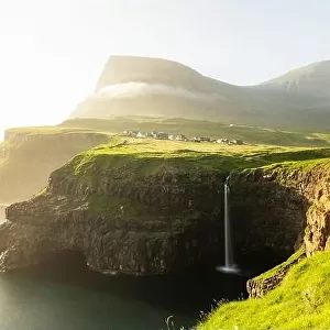 Incredible day view of Mulafossur waterfall in Gasadalur village, Vagar Island of the Faroe Islands, Denmark. Landscape photography