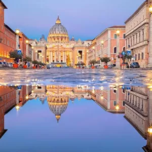 Rome, Vatican City. Cityscape image of illuminated Saint Peter`s Basilica and Street Via della Conciliazione, Vatican City, Rome, Italy