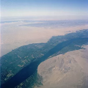 The desert areas crossed by the green ribbon of the Nile (aerial view)