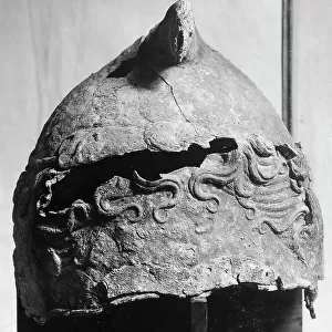 Etruscan helmet with the figure of Scylla in the National Archeological Museum of Umbria in Perugia