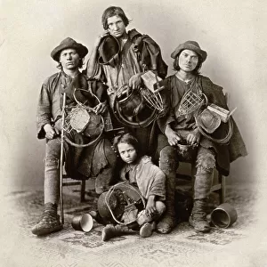 Full-length portrait of gypsies wearing dirty and tattered clothes