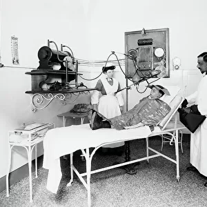 Patient at the Pellizzari Institute in Florence, assisted by a doctor and a nurse, during a therapy session