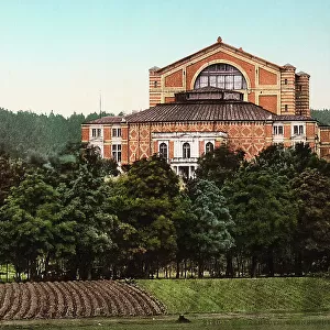 Richard Wagner Theatre in Bayreuth, Germany, rounded by a wood