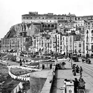 Via Santa Lucia in the district of Pizzofalcone in Naples. Mount Echia can be seen in the background