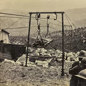 The transport of a wounded prisoner by way of a mechanical lift in the Asiago Plateau, during World War I