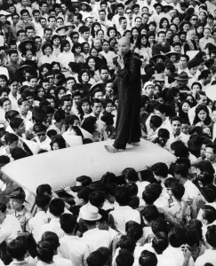 A Buddhist leader addressing a crowd of supporters from the top of a car in Saigon, South Vietnam, 16 June 1963, following the postponement of funeral services for Thich Quang Duc, the Buddhist monk who committed self-immolation five days earlier in protest of the repressive measures of President Ngo Dinh Diem A Buddhist leader addressing a crowd of supporters from the top of a car in Saigon, South Vietnam, 16 June 1963, following the postponement of funeral services for Thich Quang Duc, the Buddhist monk who committed self-immolation five days earlier in protest of the repressive measures of President Ngo Dinh Diem