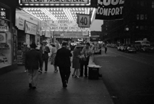 CHICAGO, 1941. Pedestrians on the street outside of a theatre in Chicago, Illinois CHICAGO, 1941. Pedestrians on the street outside of a theatre in Chicago, Illinois