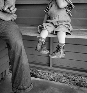 CLUB FOOT, 1939. A boy with club feet wearing homemade splints at a migrant workers CLUB FOOT, 1939. A boy with club feet wearing homemade splints at a migrant workers