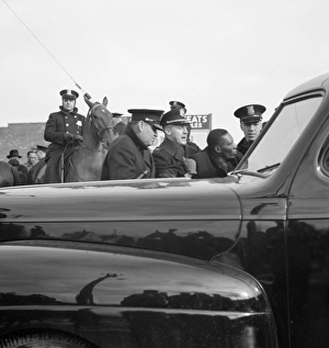 DETROIT, 1942. Police arresting a black tenant during a riot caused by white residents DETROIT, 1942. Police arresting a black tenant during a riot caused by white residents