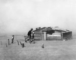A farmer and his sons walking in the face of a dust storm in Cimmarron County, Oklahoma, in April 1936. Photographed by Arthur Rothstein A farmer and his sons walking in the face of a dust storm in Cimmarron County, Oklahoma, in April 1936. Photographed by Arthur Rothstein