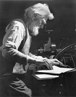HINE: PRINTER, c1905. American printer. Photograph by Lewis Hine, c1905