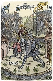 KING ARTHUR FIGHTS A GIANT. Protected by the Virgin. Woodcut, French, 1514 KING ARTHUR FIGHTS A GIANT. Protected by the Virgin. Woodcut, French, 1514
