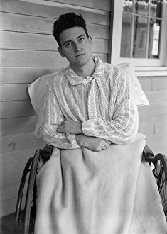 MAN, c1915. A man sitting in a wheelchair, possibly at an open air sanitorium. Photograph MAN, c1915. A man sitting in a wheelchair, possibly at an open air sanitorium. Photograph