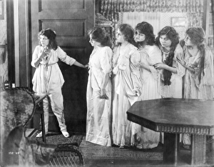 Marguerite Clark and other cast members in a scene from the silent film, 1916; American Marguerite Clark and other cast members in a scene from the silent film, 1916; American