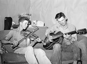MUSICIANS, 1940. A farmer and his brother playing music at home in Pie Town, New Mexico MUSICIANS, 1940. A farmer and his brother playing music at home in Pie Town, New Mexico