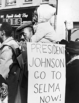 NEW YORK: CIVIL RIGHTS PROTEST, 1965. An African American man with a child on his NEW YORK: CIVIL RIGHTS PROTEST, 1965. An African American man with a child on his