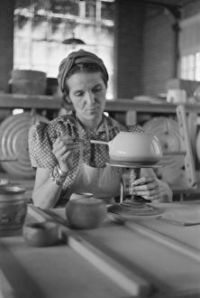 POTTERY MAKING, 1940. A woman working at a pottery wheel, possibly at the Indian POTTERY MAKING, 1940. A woman working at a pottery wheel, possibly at the Indian