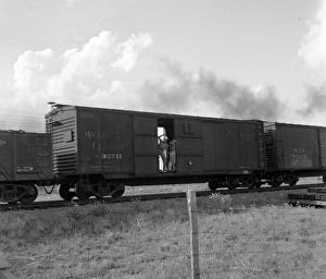 RAILROAD, 1937. Men riding on a freight train in West Texas. Photograph by Dorothea Lange RAILROAD, 1937. Men riding on a freight train in West Texas. Photograph by Dorothea Lange