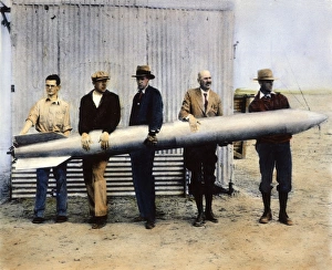 ROBERT HUTCHINGS GODDARD. (1882-1945) fourth from left, and assistants L. Mansur, A