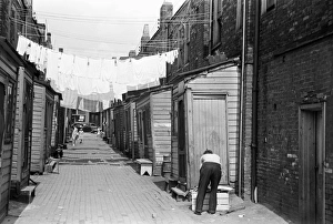 ROW HOUSE, 1938. A row of low-income houses in Ambridge, Pennsylvania ROW HOUSE, 1938. A row of low-income houses in Ambridge, Pennsylvania