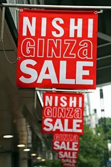 Nishi Ginza Sale signs advertising shop sales in Ginza, Tokyo, Japan