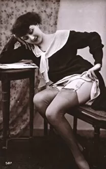 Woman at a table, exposing her stockings